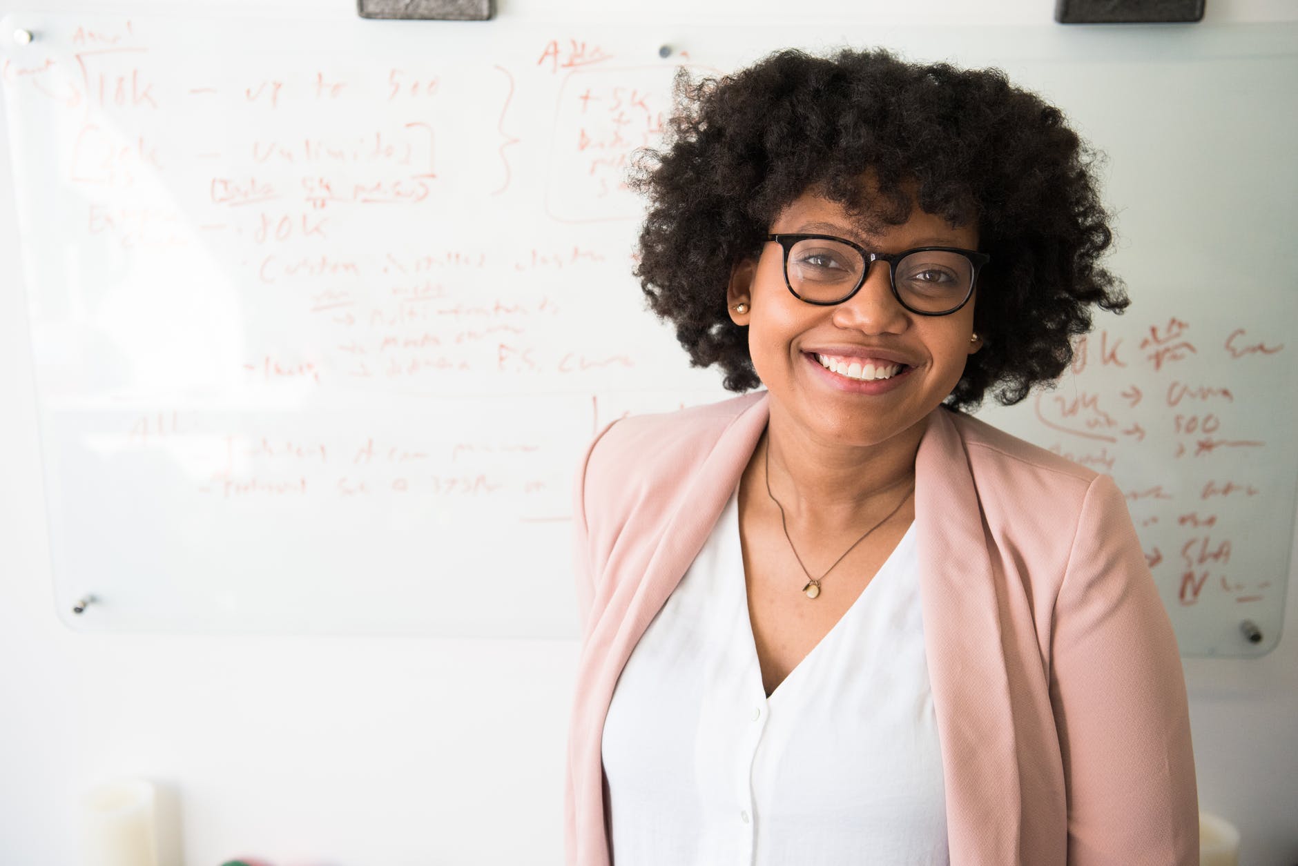 Substitute teacher, woman standing near whiteboard